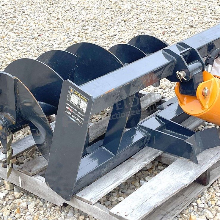 Unused Wolverine skid steer auger w/ 2 augers